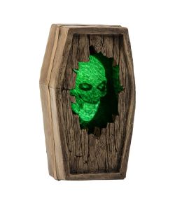 Uhyggeligt hjemsøgt kiste med grønt kranie.