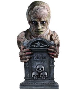 Mumie med gravsten.